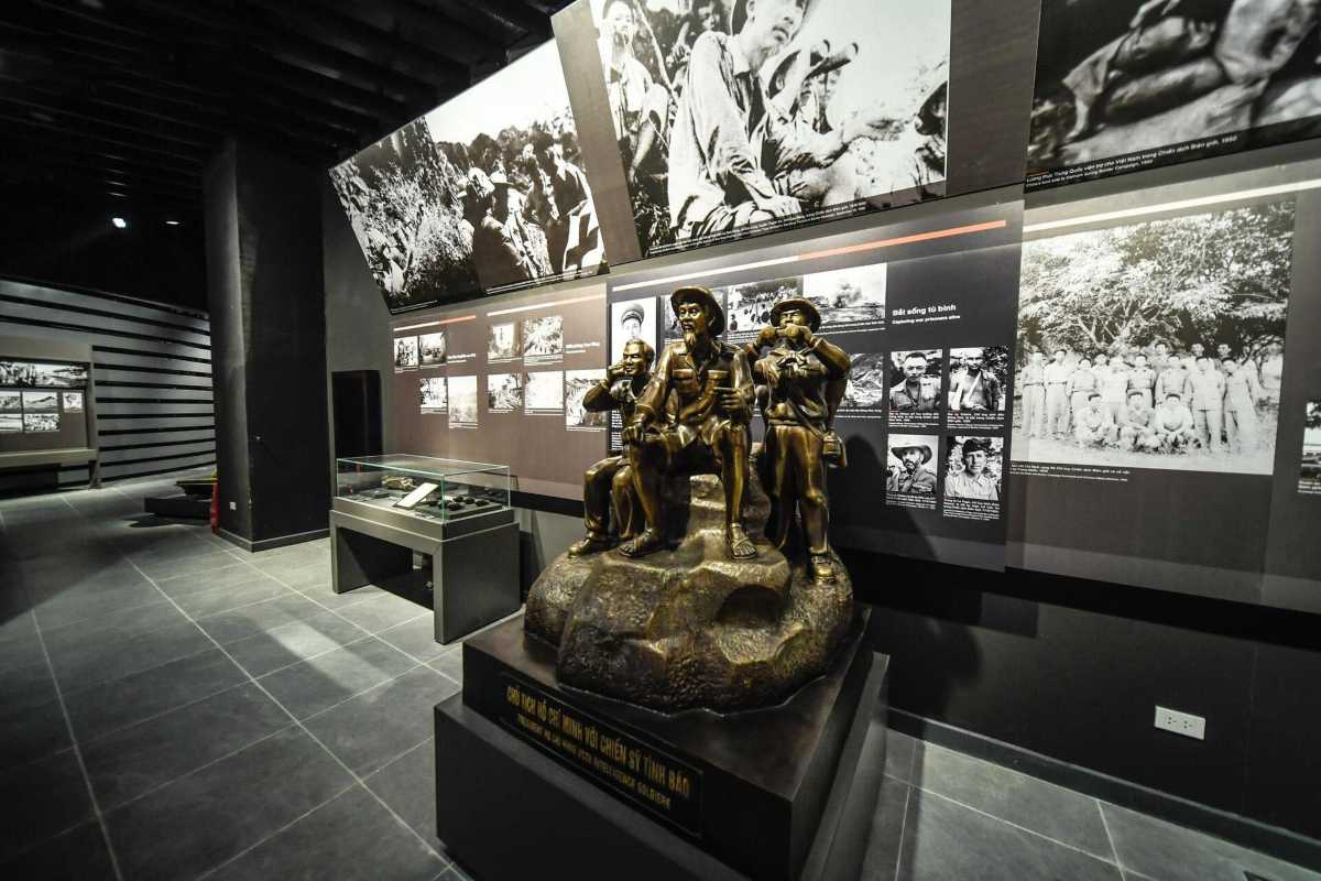 Vietnam Military History Museum Guided Tour Group of visitors on a guided tour inside the museum learning about military exhibits
