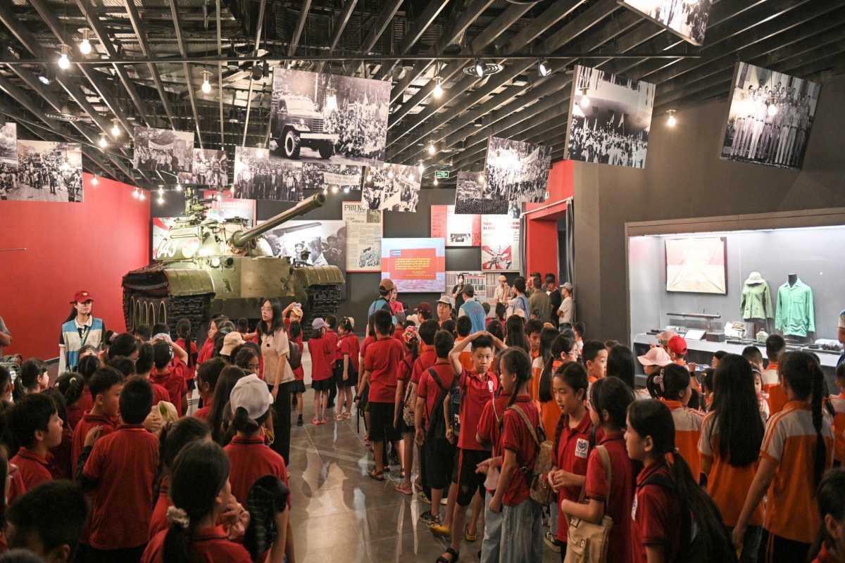 Vietnam Military History Museum Indoor Artifacts Indoor display cases with historic artifacts including uniforms, flags, and documents