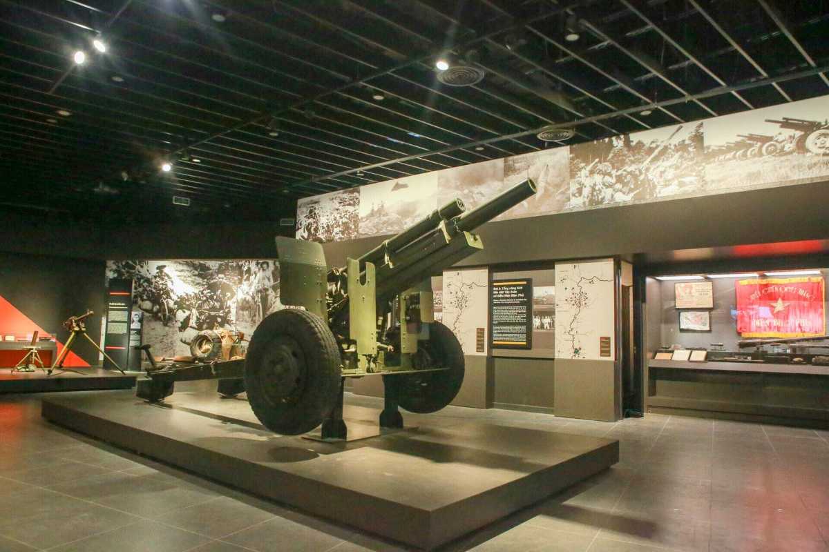 Vietnam Military History Museum Missile Display Visitors observing missile and anti-aircraft weapon exhibits inside the Vietnam Military Museum