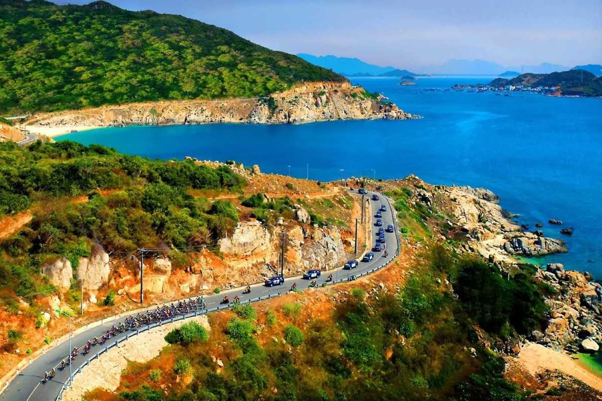 Vinh Hy Bay Coastal Road and Ocean View Coastal road winding along the ocean with lush green hills at Vinh Hy Bay