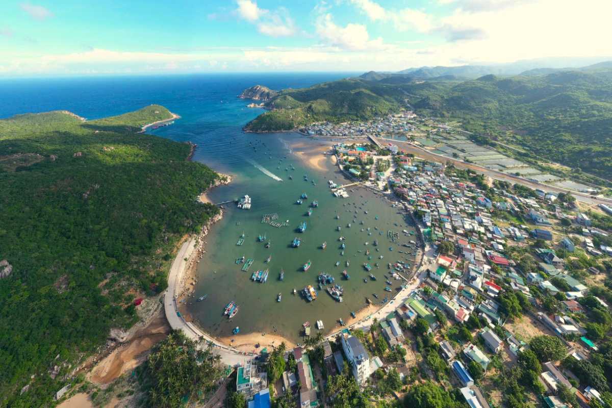 Vinh Hy Bay Village and Bay Overview of Vinh Hy Bay village and bay with fishing boats docked along the shoreline