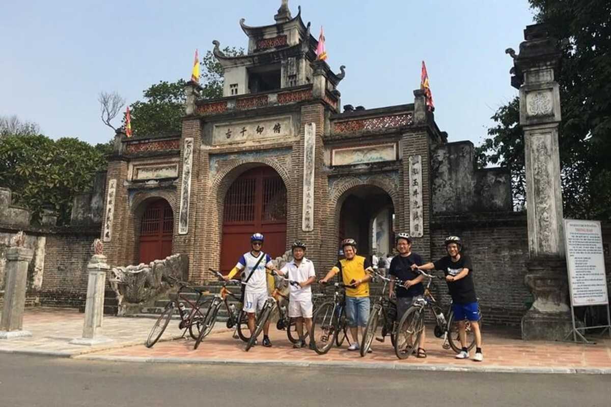 Visitors Cycling at Co Loa Ancient Citadel Group of visitors with bicycles in front of Co Loa Ancient Citadel’s main entrance