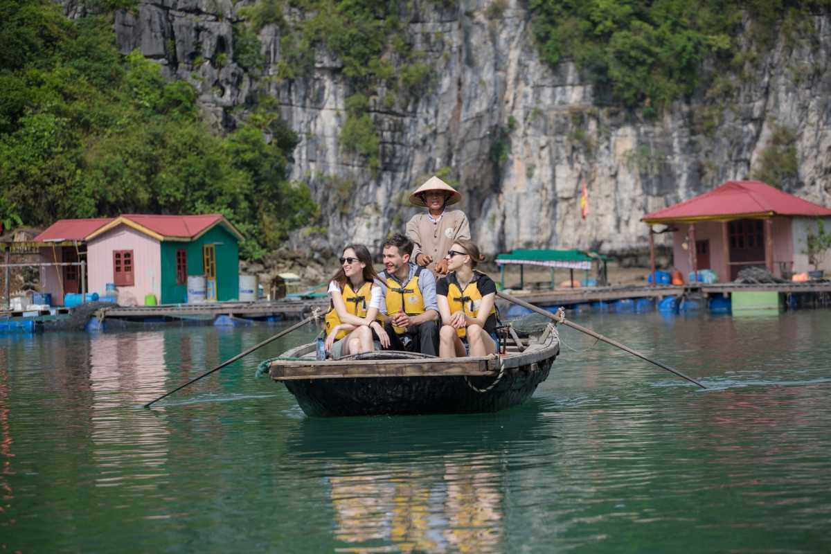 Vung Vieng Fishing Village floating raft homes Floating raft homes with vibrant colors in Vung Vieng Fishing Village on Halong Bay
