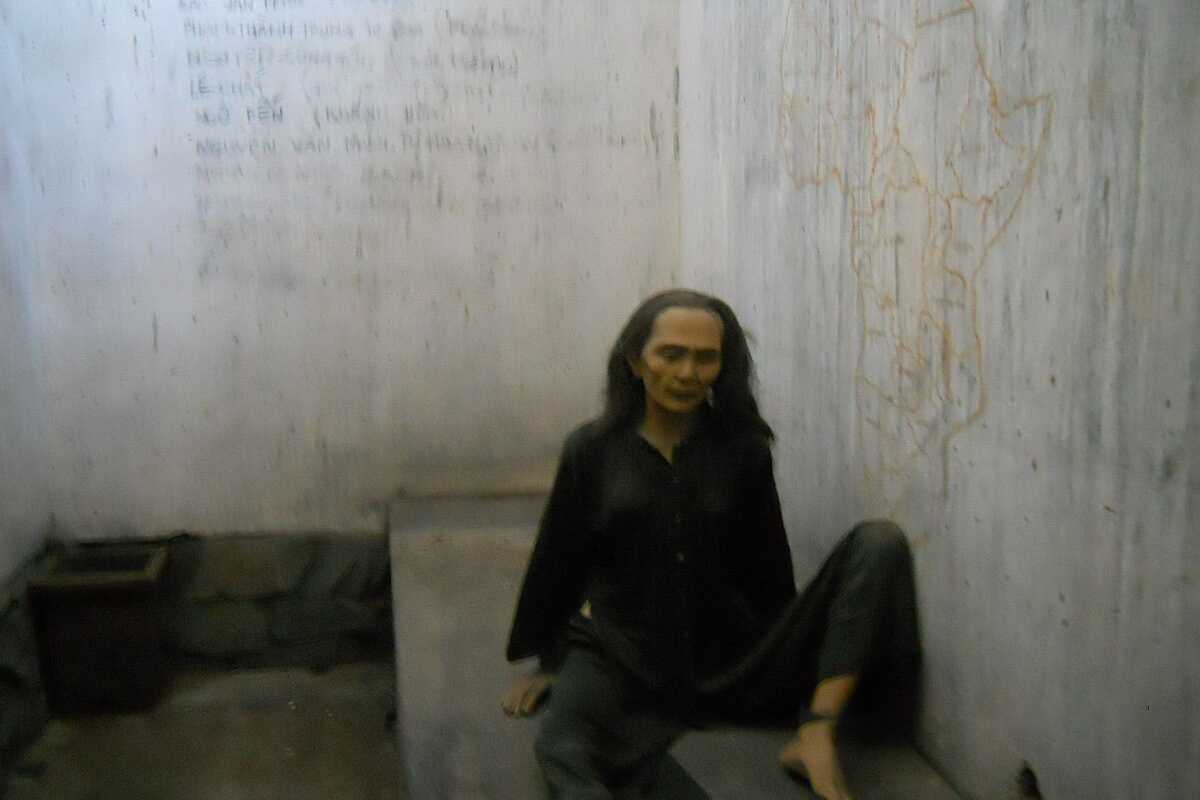 War Remnants Museum Prisoner Woman Mannequin Exhibit Mannequin of a female prisoner in confinement at the War Remnants Museum illustrating wartime hardships