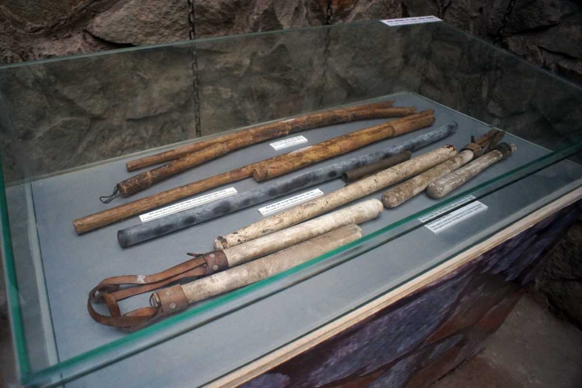 War Remnants Museum Torture Instruments Display Torture instruments display at the War Remnants Museum showing wooden and metal tools used during the Vietnam War