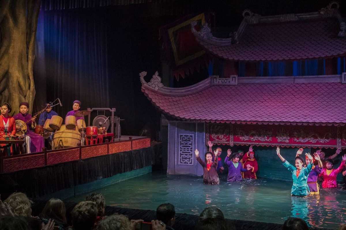 Water Puppet Musicians Playing Traditional Drums Musicians playing traditional drums and instruments accompanying the water puppet performance
