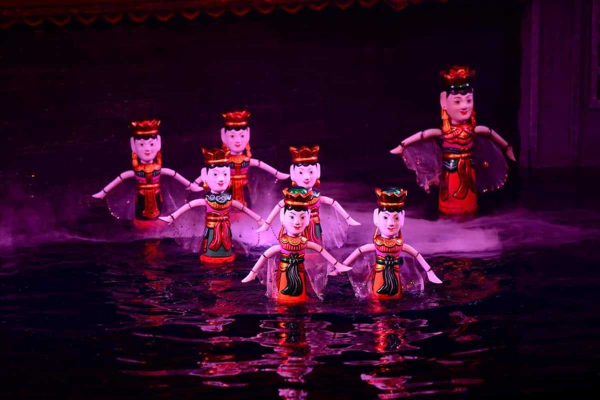 Water Puppets on Horseback in Show Puppets riding horses in a traditional battle scene during the show