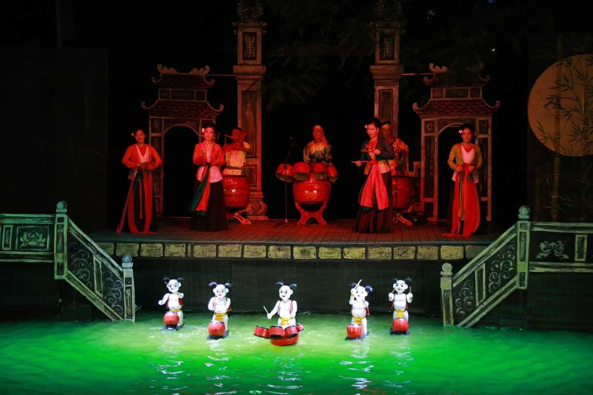 Puppets Performing a Folk Tale Scene Water puppets acting out a popular Vietnamese folk tale on the water stage