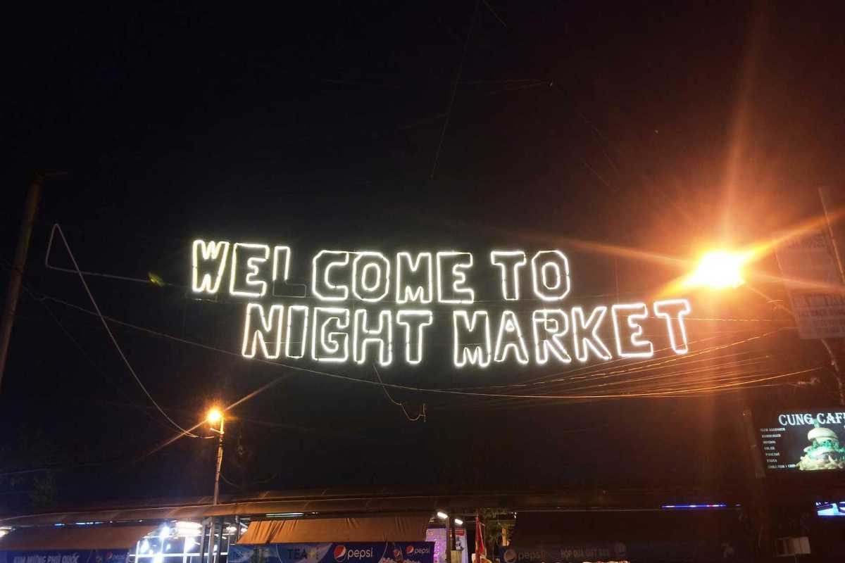 Welcome Sign at Duong Dong Night Market Illuminated welcome sign at Duong Dong Night Market entrance during nighttime