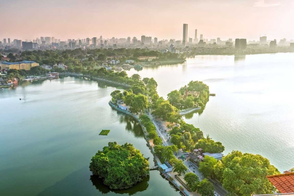 West Lake Hanoi Beautiful Green Island Lush green island in the middle of West Lake Hanoi surrounded by water and residential areas
