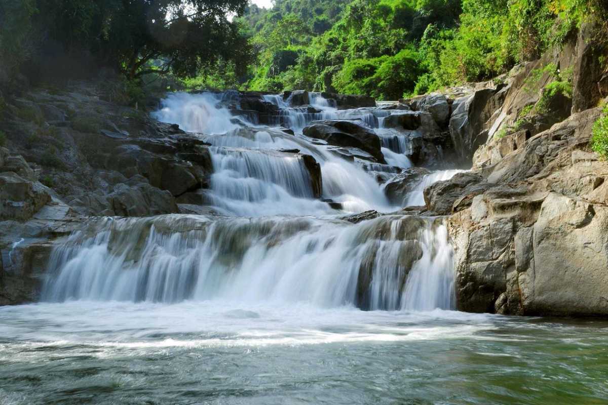 Main falls at Yang Bay Waterfall Wide angle view of the cascading multi-tiered main falls at Yang Bay with surrounding greenery