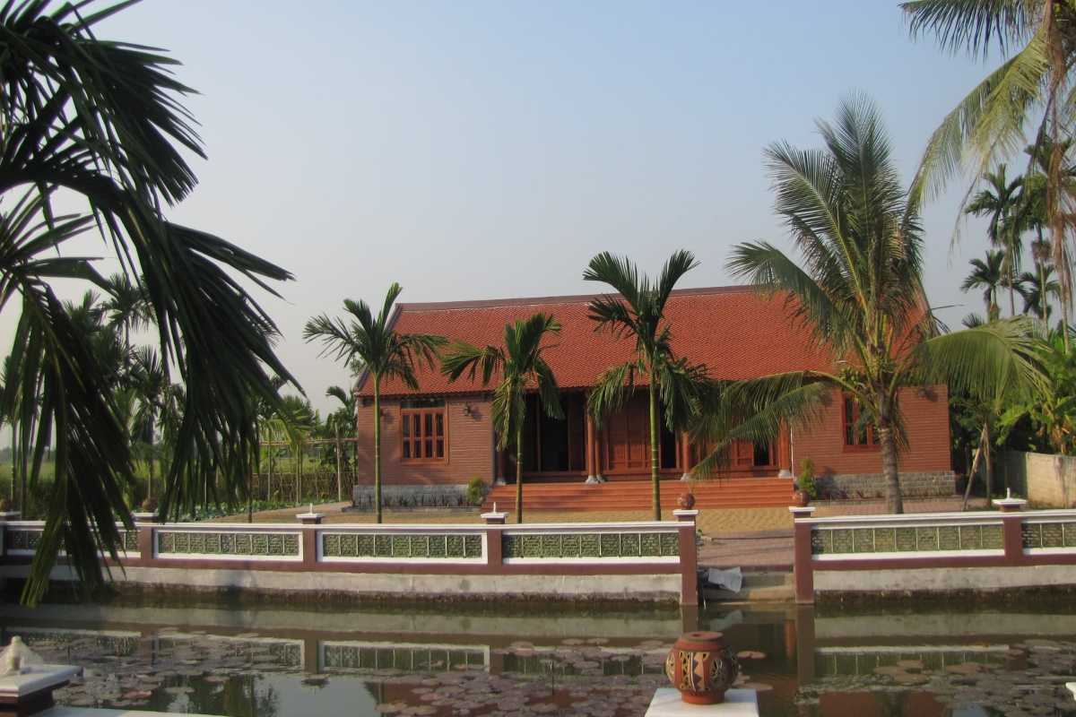 Traditional Garden and Lotus Pond at Yen Duc Village Beautiful garden with lush plants and lotus pond at Yen Duc Village surrounded by rural landscapes.