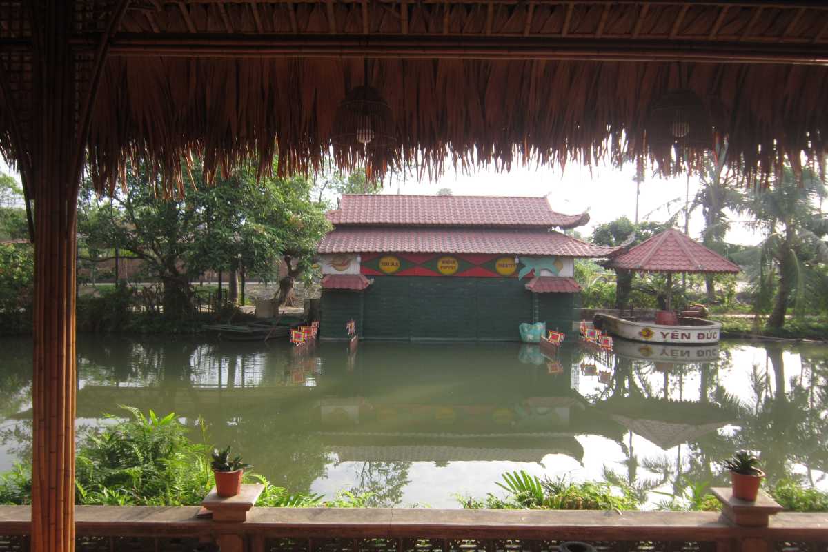 Yen Duc Village Quang Ninh traditional water puppet stage view Traditional water puppet theater stage and pond at Yen Duc Village Quang Ninh, showcasing cultural heritage