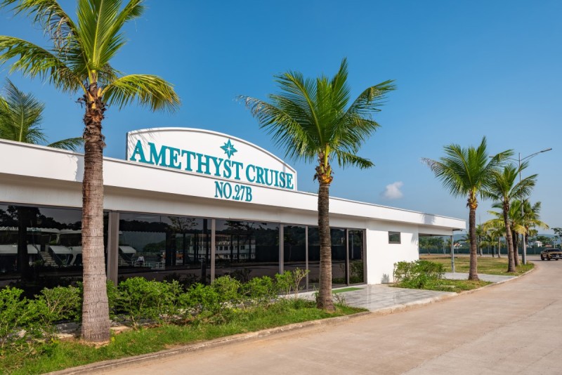 Entrance of Amethyst Cruise facility with palm trees