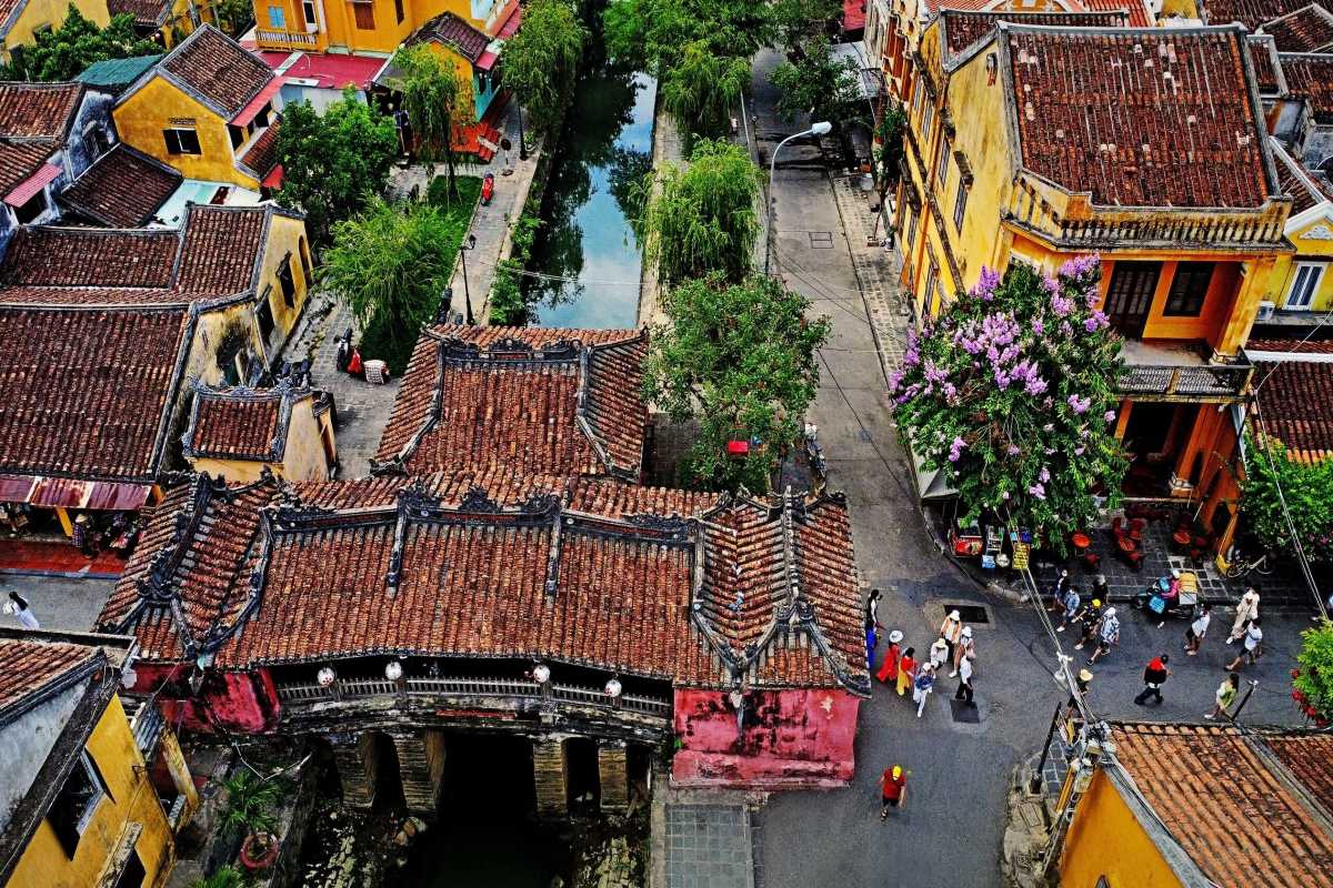 Aerial Night View of Hoi An Ancient Town Night aerial shot of Hoi An Ancient Town showing illuminated bridges and boats on the river