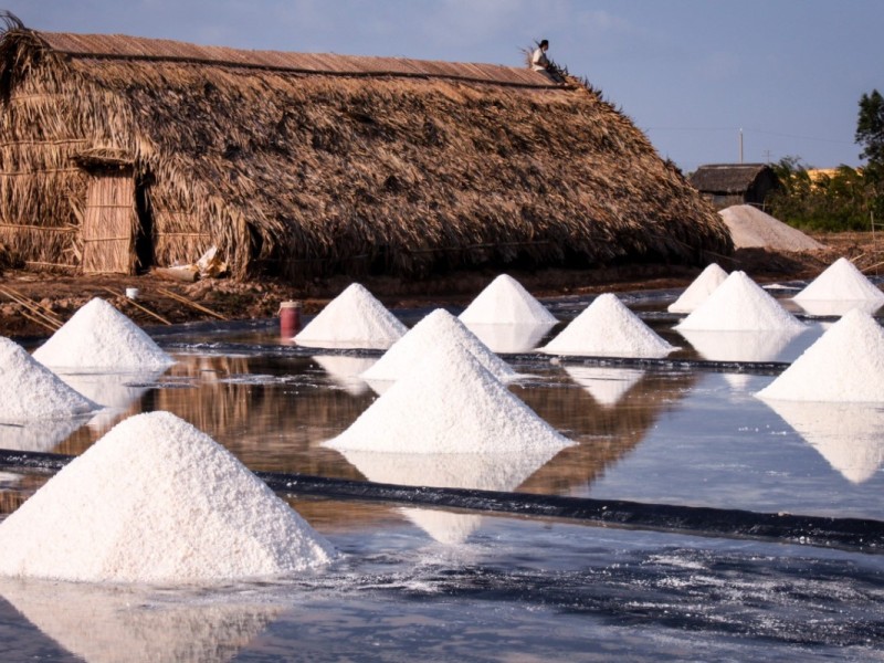 Aerial view of Bac Lieu salt production fields with workers