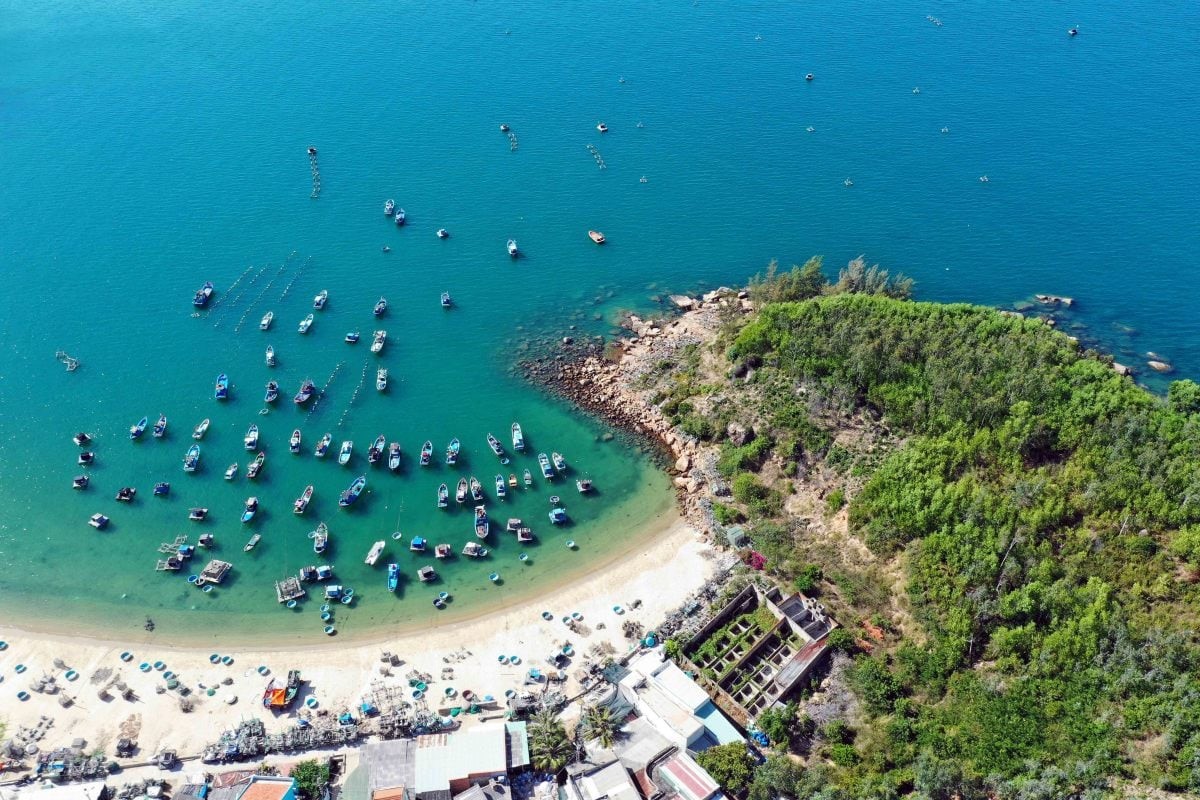 Aerial view of Bai Xep Beach in Binh Dinh Province with fishing boats floating on clear blue waters