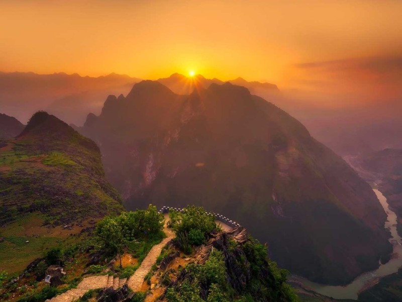 A picturesque landscape in Ha Giang, Vietnam, capturing lush greenery and mountainous terrain.