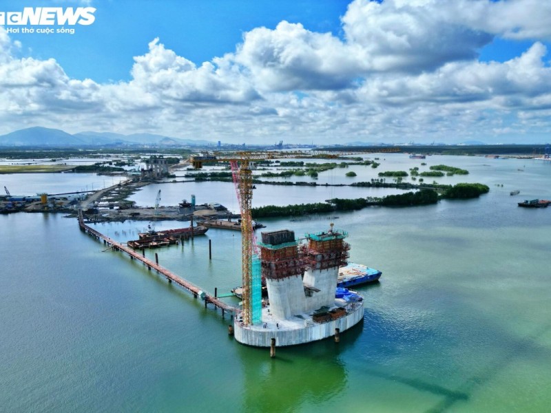 Bridge construction in Vung Tau over a serene river with surrounding landscape