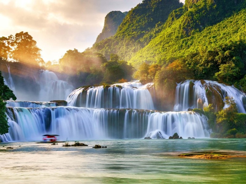 Aerial view of Ban Gioc Waterfall in Cao Bang, showcasing its vast scale and beauty from above.