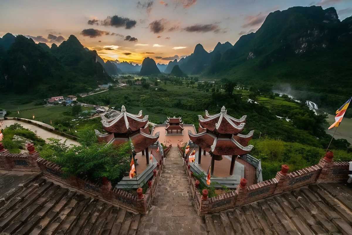 Cao Bang Travel Guide Sunset View from Pagoda Sunset view over Cao Bang’s mountains and valley from a Buddhist pagoda overlooking the landscape