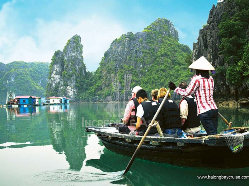 Tourists exploring Bai Tu Long Bay by boat