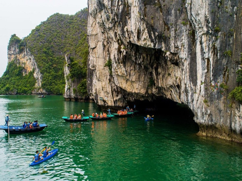 Kayakers exploring Luon Cave in Lan Ha Bay