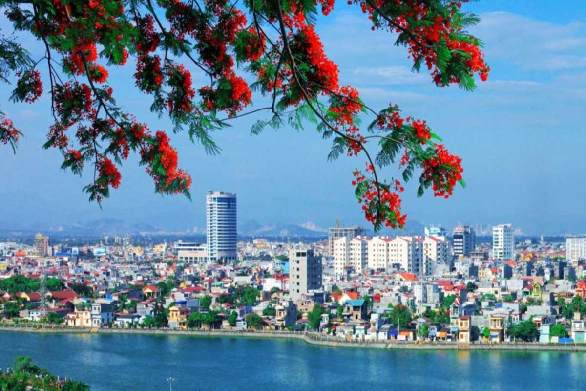 Hai Phong bay limestone karsts and calm waters Calm waters of Hai Phong bay dotted with towering limestone karsts and small boats