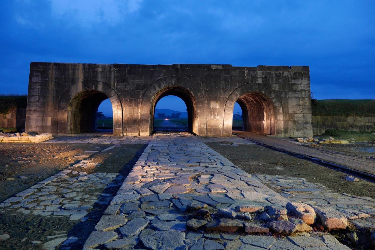 Ho Citadel in Thanh Hoa at dusk showcasing the historic stone archways