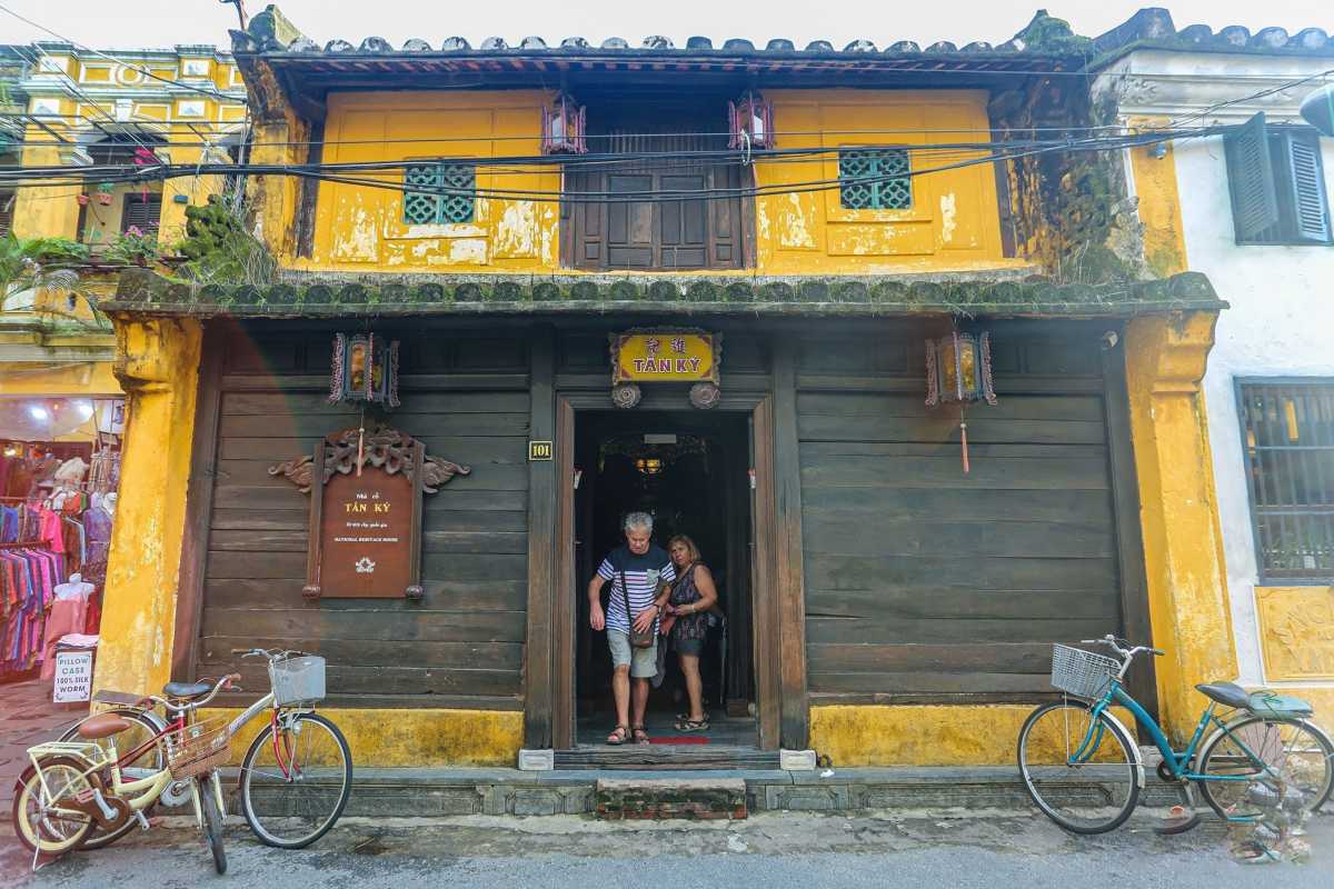 Hoàng Hà Cafe Restaurant Entrance with Lanterns Cozy cafe entrance decorated with lanterns in Hoi An Ancient Town, with guests enjoying food