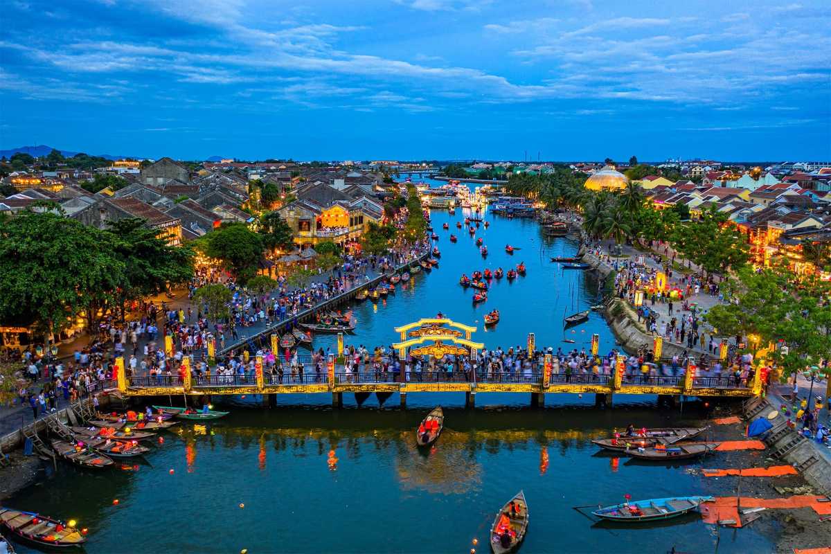Aerial View of Hoi An Ancient Town with River High view of Hoi An Ancient Town, river, and boats bustling with activity