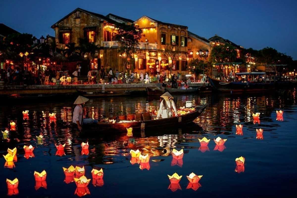 Hoi An Riverside Houses with Boats Traditional riverside houses and boats reflecting on calm water in Hoi An Ancient Town