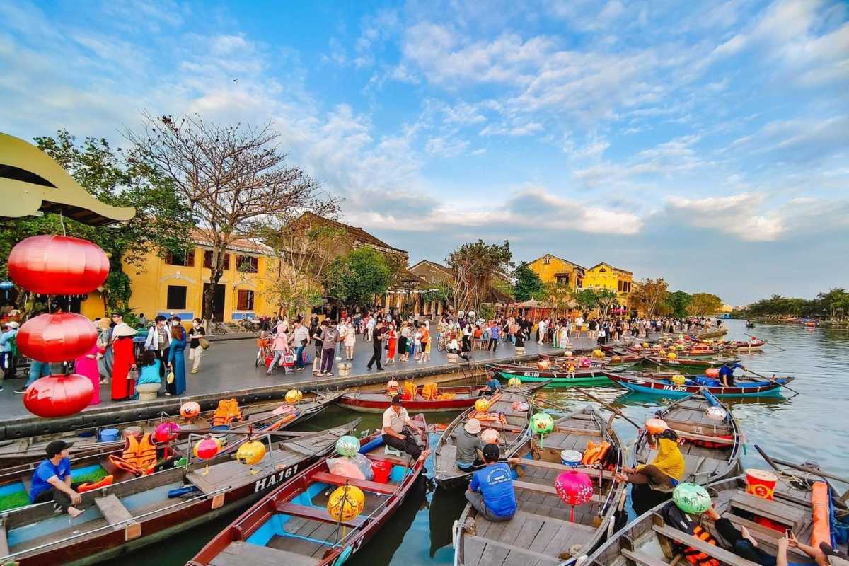 Hoi An Street Scene with Yellow Buildings Traditional yellow buildings lining a busy street in Hoi An Ancient Town