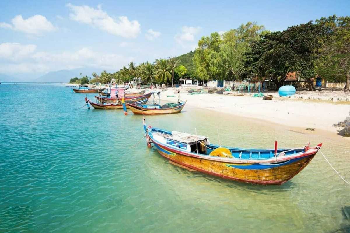 Fishing Boats at Hon Ro Port Colorful wooden fishing boats floating near the shore of Hon Ro in Nha Trang.