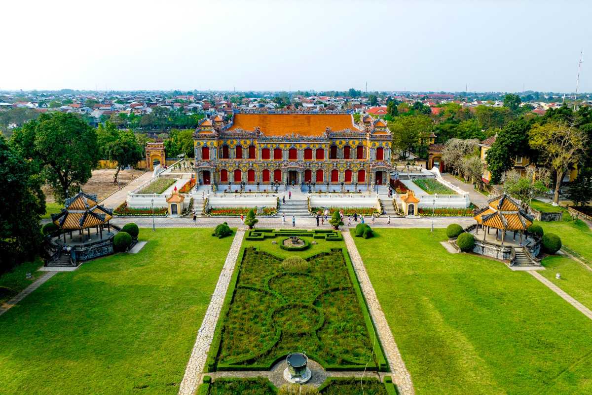 Hue Travel Guide Large Garden in Imperial City Hue Travel Guide displays a large manicured garden area within the Imperial City, framed by historic buildings.