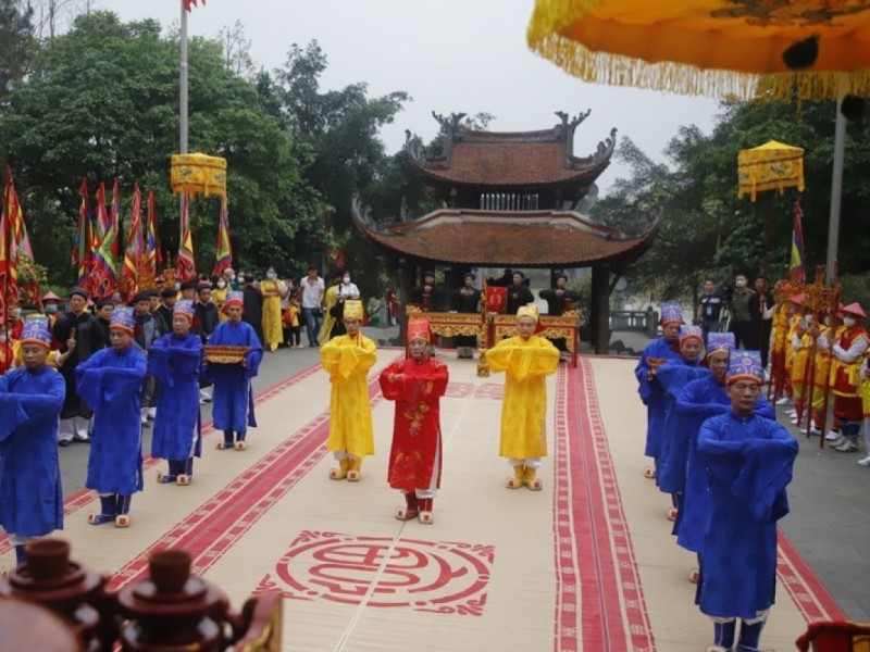 Traditional procession at the Hung King Temple Festival in Phu Tho, with participants in colorful ceremonial attire