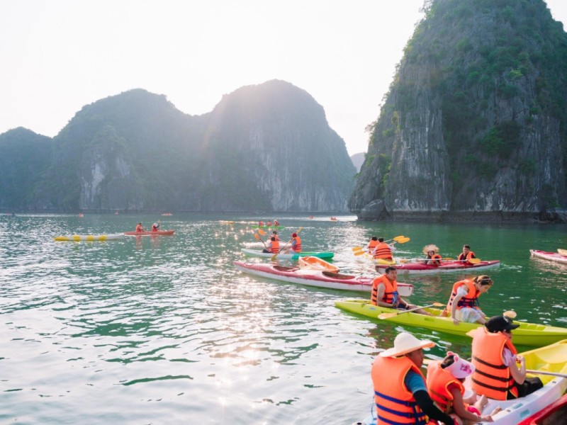 People kayaking in the scenic waters of Lan Ha Bay