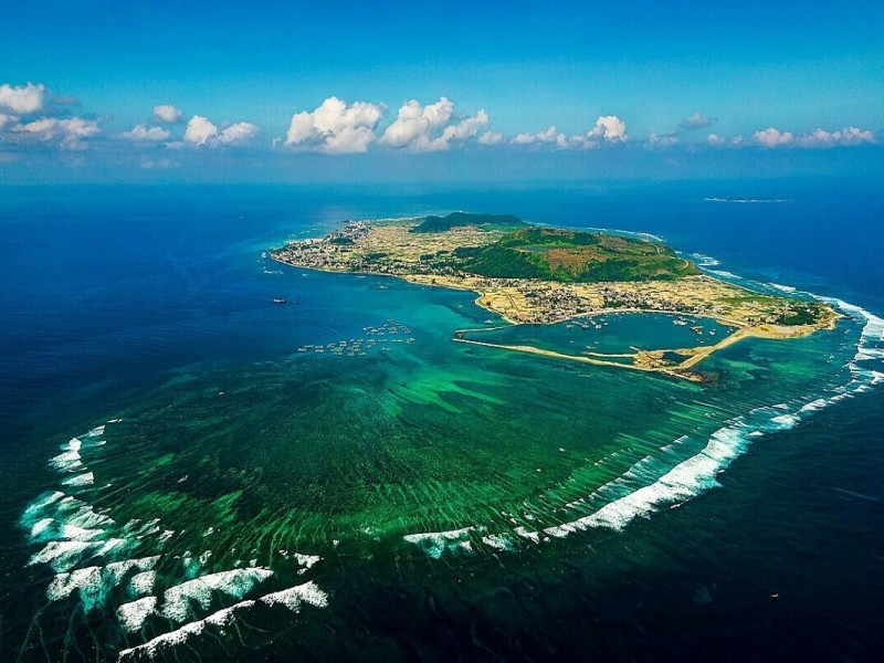 Aerial view of Ly Son Island in Quang Ngai, surrounded by pristine blue waters and agricultural lands.