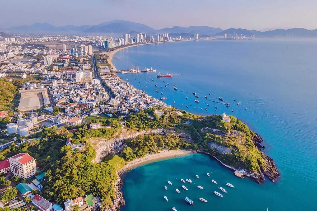 Nha Trang Panoramic Bay View Stunning panoramic view of Nha Trang Bay with green hills and turquoise sea.