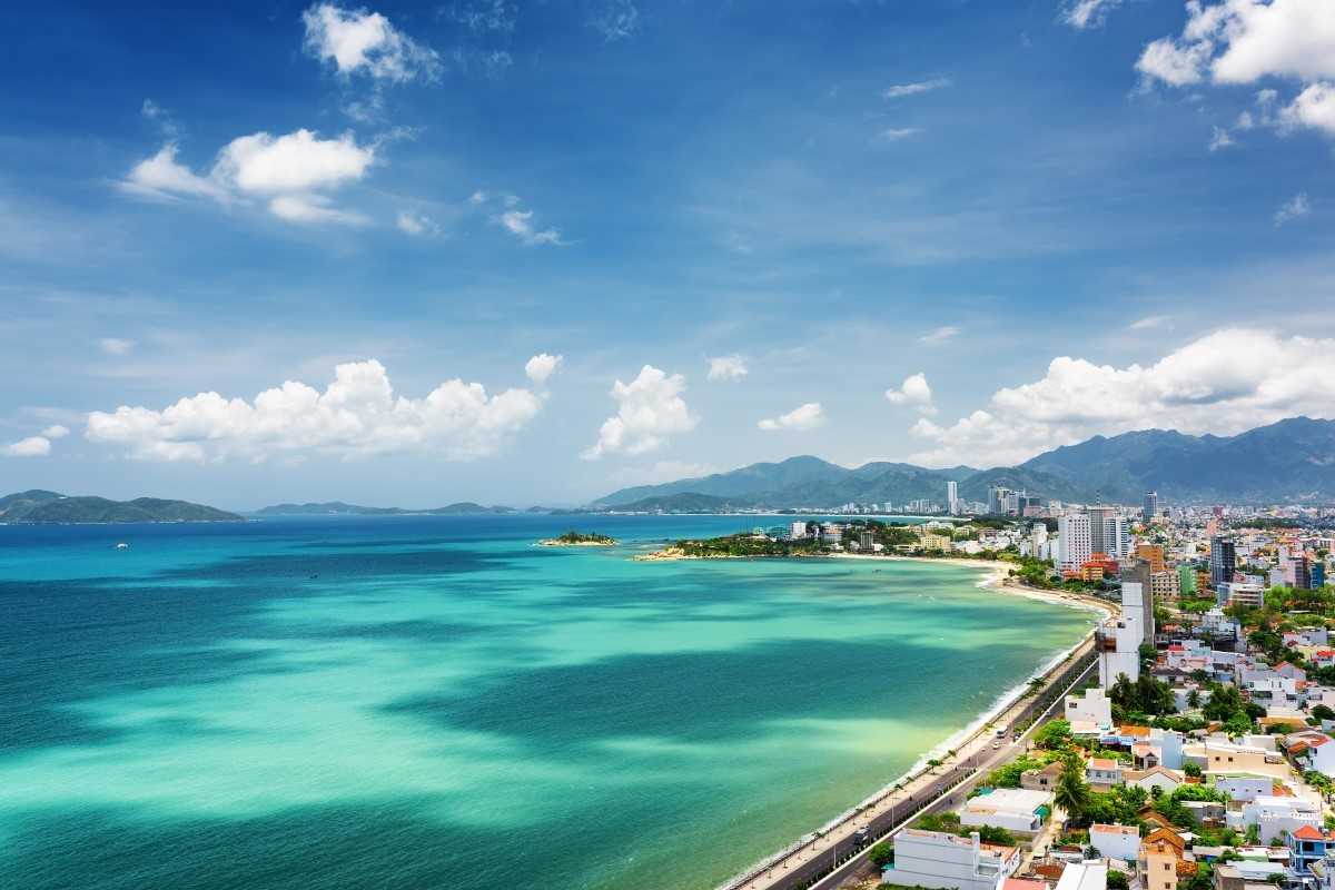 Nha Trang City Coastline Overview of Nha Trang City along its coastline with turquoise sea and bustling cityscape.