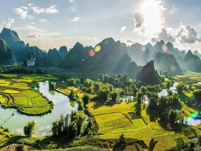 Stunning view of Phong Nam Valley in Cao Bang with lush greenery and peaceful water bodies.