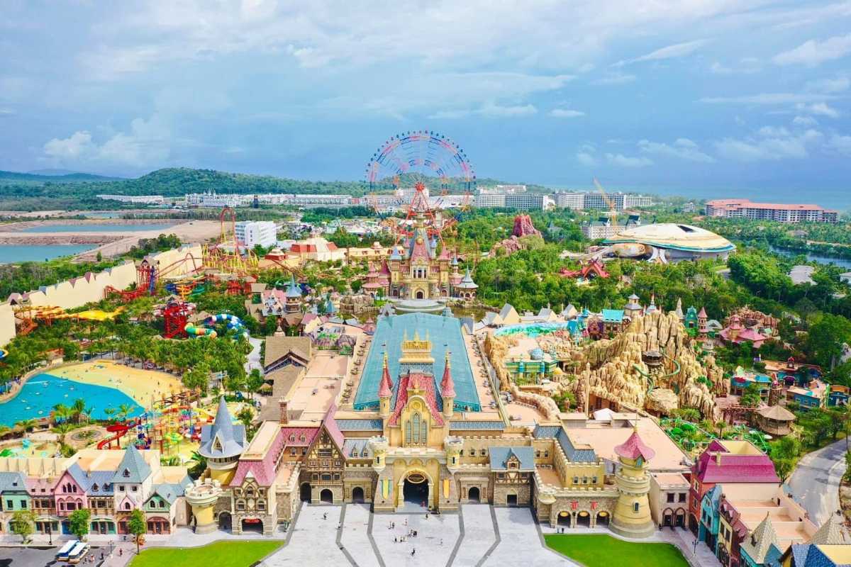 Phu Quoc Travel Guide Colorful Amusement Park with Ferris Wheel Phu Quoc Travel Guide colorful amusement park featuring a large ferris wheel and vibrant rides surrounded by trees