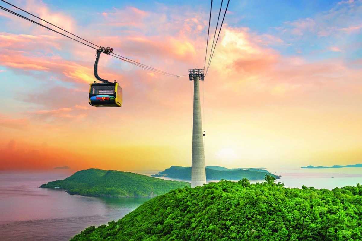 Phu Quoc Travel Guide Scenic Cable Car Ride Over Lush Island Phu Quoc Travel Guide scenic cable car soaring over lush green hills and ocean views at sunset