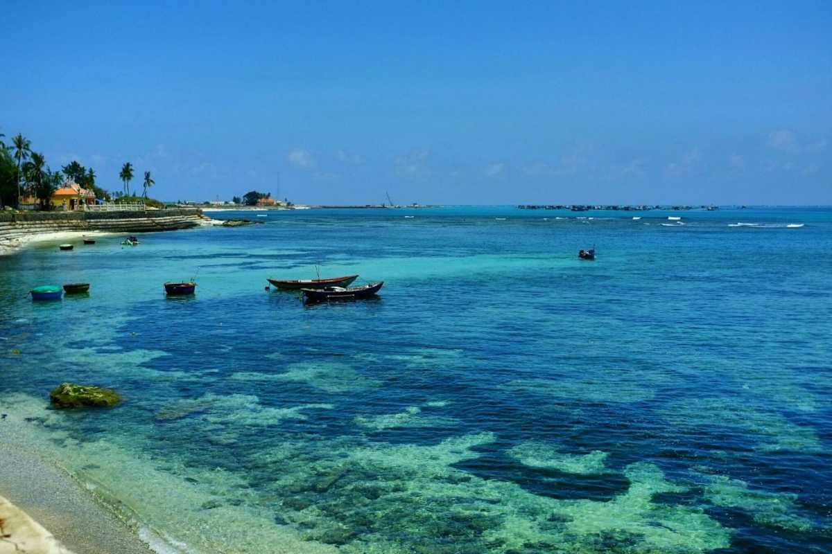 Quang Ngai Coastal Lagoon and Bridge Landscape Panoramic view of coastal lagoon and bridge crossing with green landscapes in Quang Ngai, Vietnam.