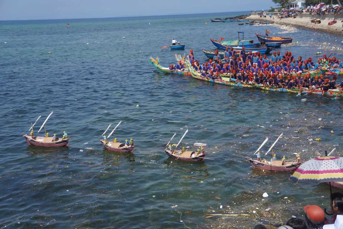 Quang Ngai Traditional Dragon Boat Festival on Sea Colorful traditional dragon boats racing on the sea during festival in Quang Ngai, Vietnam.