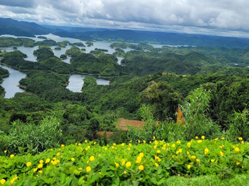 Beautiful Ta Dung Lake surrounded by green hills in Dak Nong