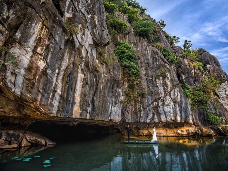 Scenic view of Kim Son Cave in Thanh Hoa with limestone cliffs and water