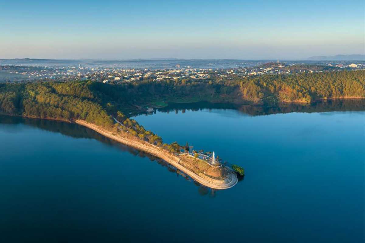 T’Nung Lake Scenic Peninsula in Gia Lai Scenic peninsula with a walking path extending into T’Nung Lake surrounded by greenery