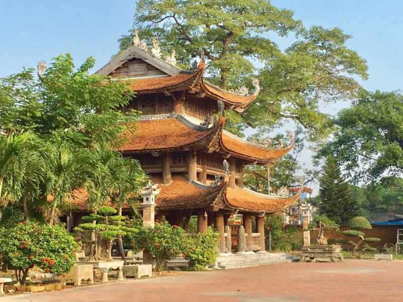 Traditional wooden pagoda with intricate carvings in the heart of Hung Yen