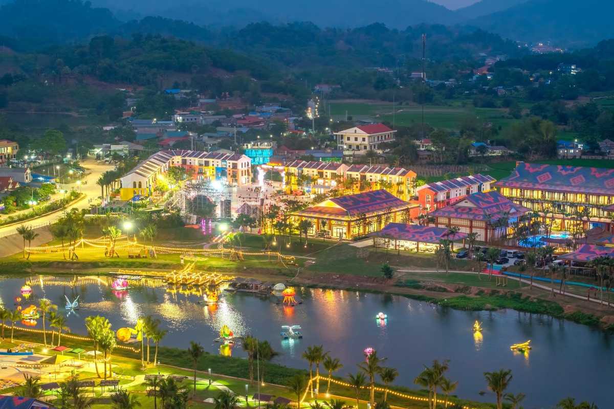 Tuyen Quang Night View Resort and Lake Night view of Tuyen Quang resort area with illuminated buildings and decorative lights near lake and hills
